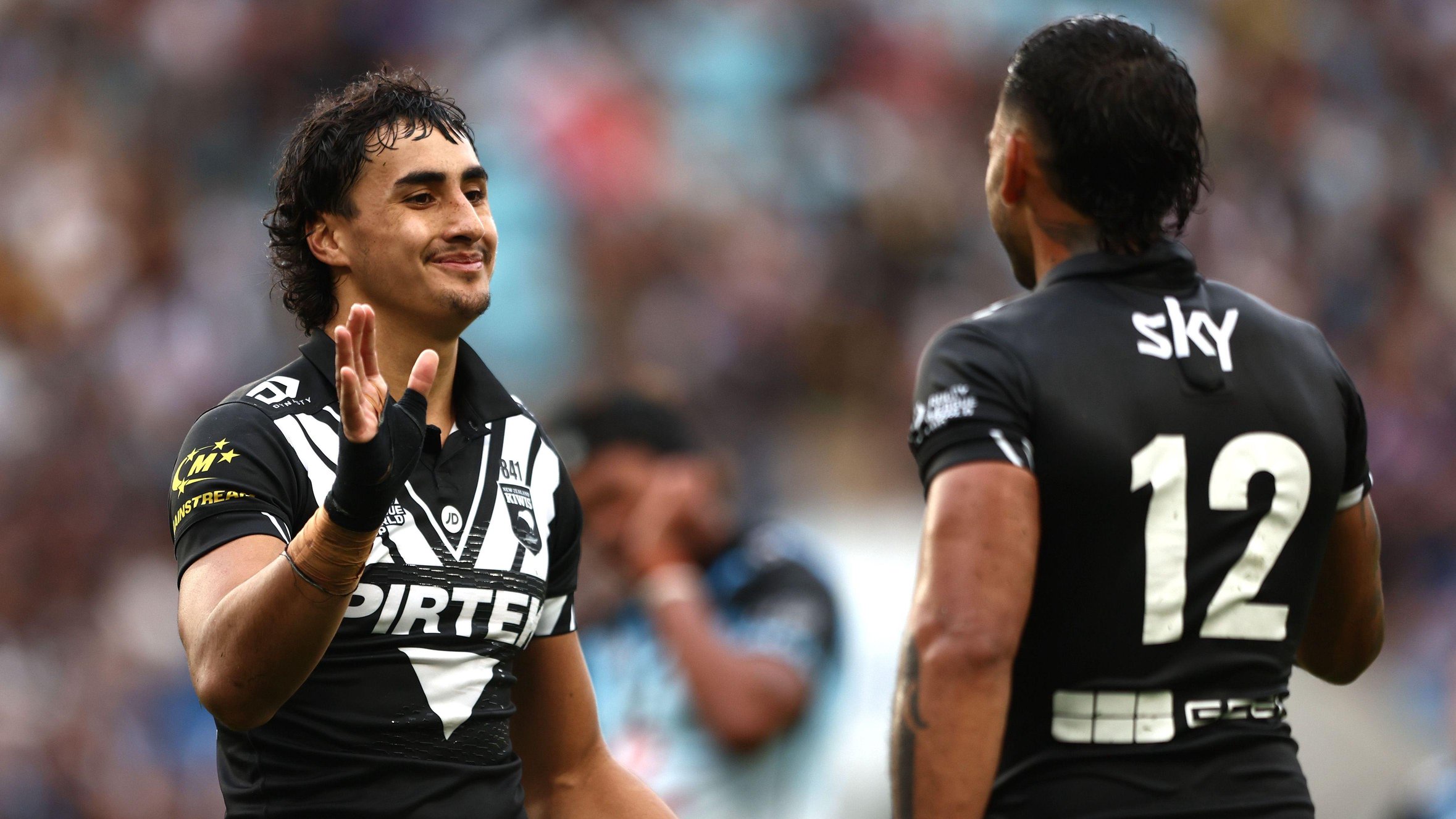 Casey McLean celebrates after scoring a try for New Zealand