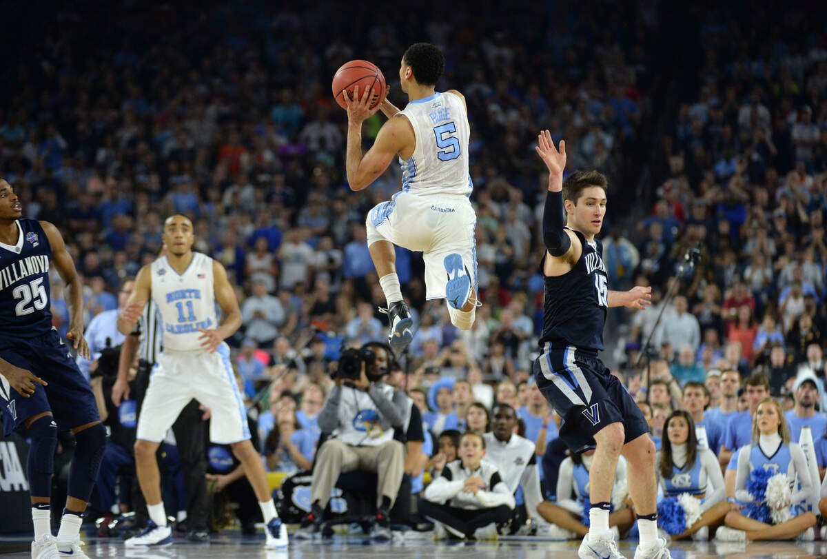 North Carolina's Marcus Paige (5) makes an off-balance three-pointer to tie the game during the second half of Villanova's 77-74 victory in the finals of the 2016 NCAA championship in Houston on April 4, 2016.