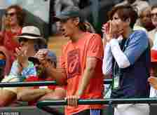 The No 32 seed was later roared on by her boyfriend, No 9 seed Alex De Minaur (centre)