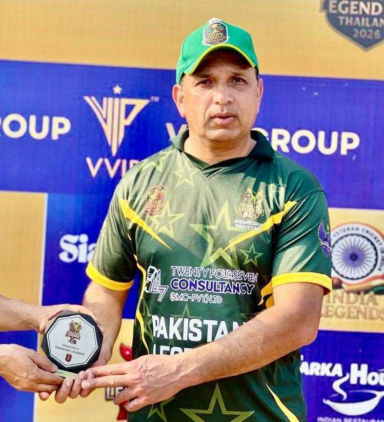 Lymington CC's Asad Abbas with his award for the best Pakistani player