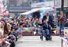 Former RAF Sergeant Bernard Morgan in his wheelchair is cheered by the crowd who assembled to salute the heroic veterans