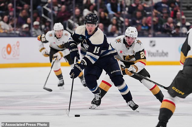 Columbus Blue Jackets center Adam Fantilli (19) controls the puck in front of Vegas Golden Knights left wing Trevor Connelly (24) during the second period of an NHL hockey game Saturday, Oct. 24, 2026, in Columbus, Ohio. (AP Photo/Joshua A. Bickel)