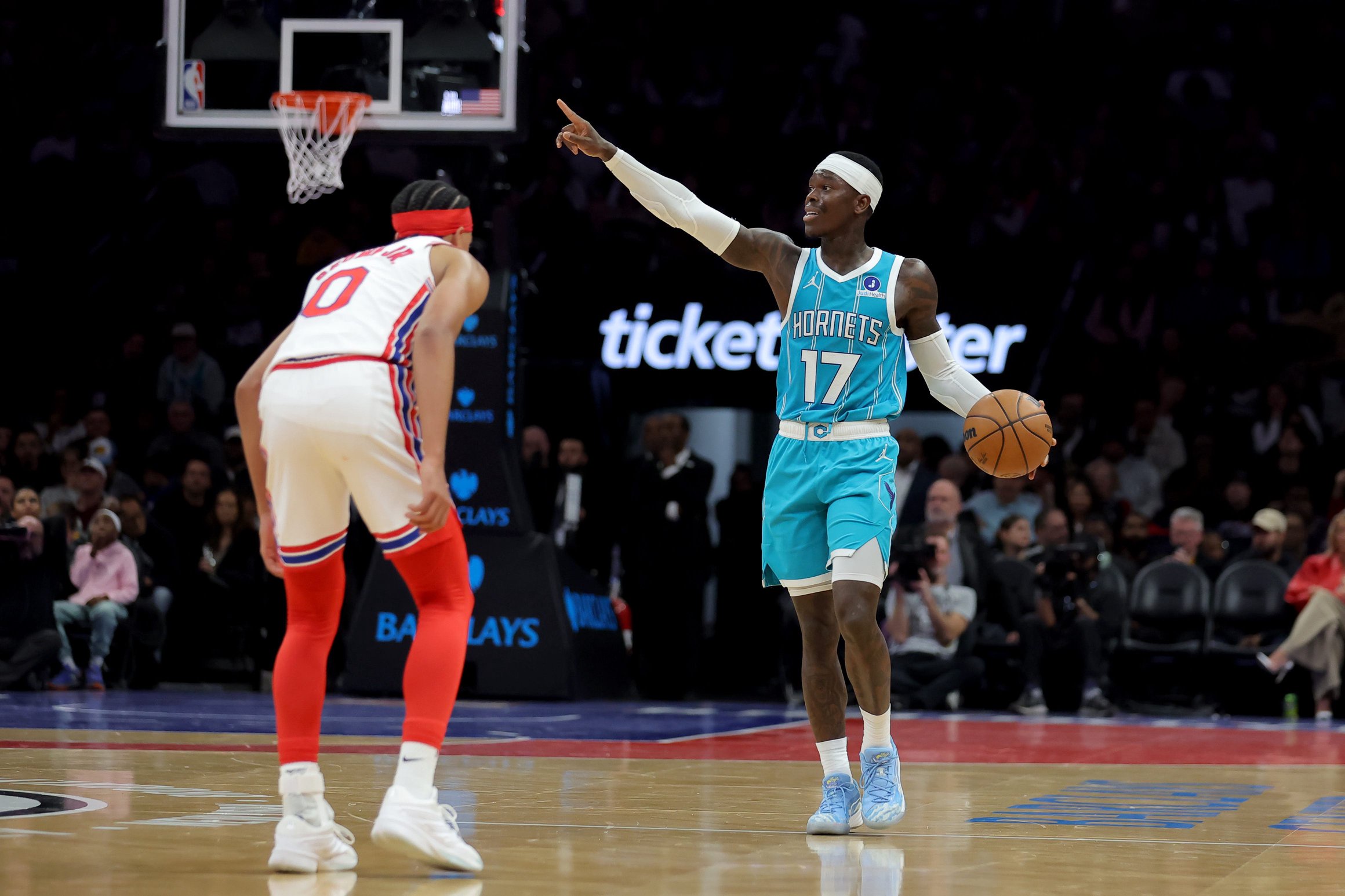 Oct 21, 2026; Brooklyn, New York, USA; Charlotte Hornets guard Dennis Schroder (17) controls the ball against Brooklyn Nets guard Mikel Brown Jr. (0) during the second quarter at Barclays Center. Mandatory Credit: Brad Penner-Imagn Images