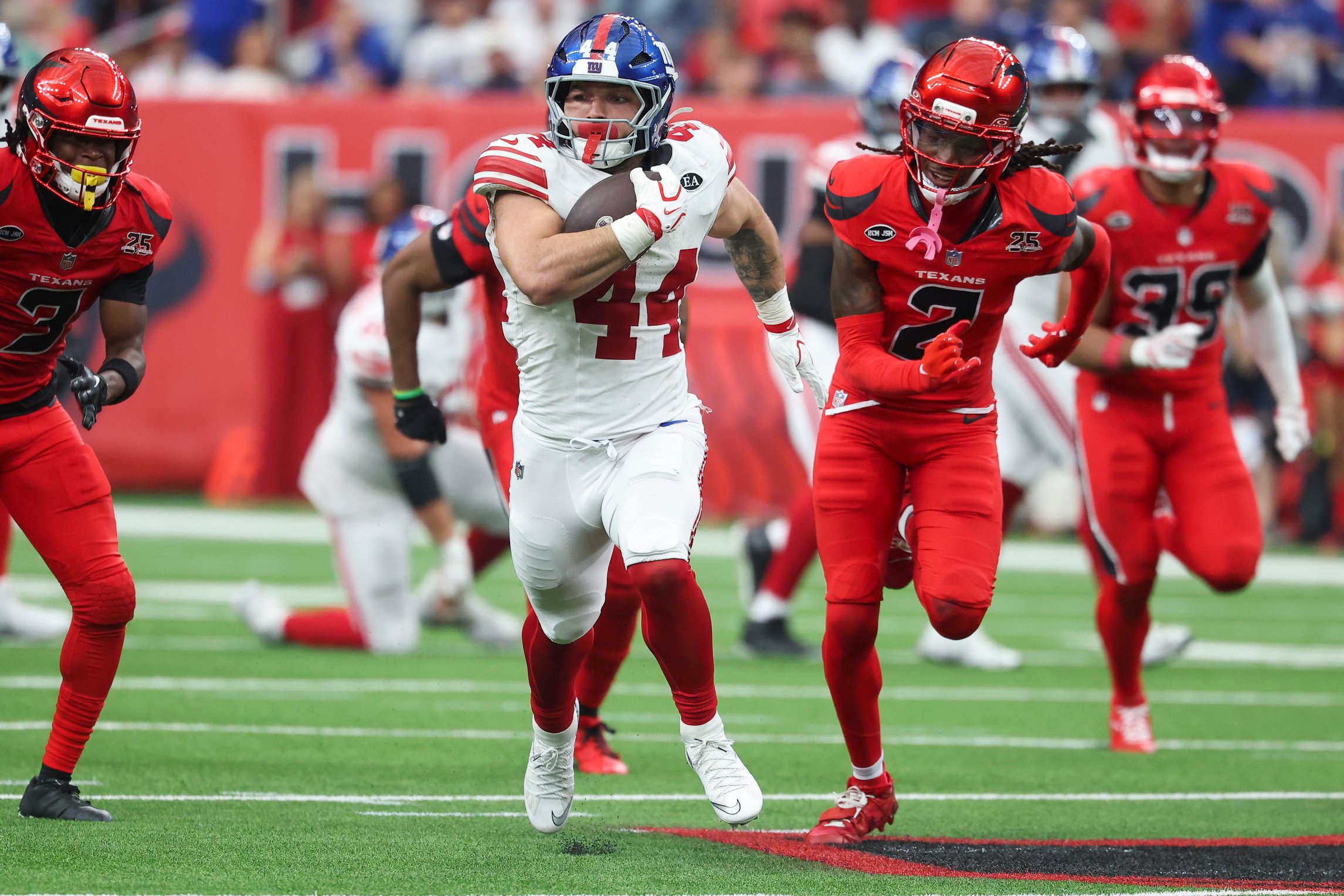 Oct 25, 2026; Houston, Texas, USA;  New York Giants running back Cam Skattebo (44) runs with the ball during overtime against the Houston Texans at Reliant Stadium.  Mandatory Credit: Troy Taormina-Imagn Images