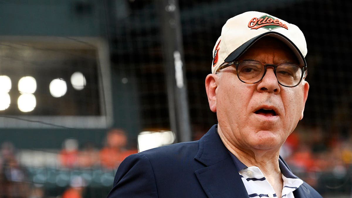 David Rubenstein stands on the field before the game at Oriole Park at Camden Yards.