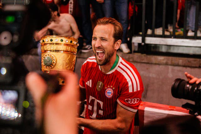 Kane celebrates after scoring a hat-trick in the German Cup final