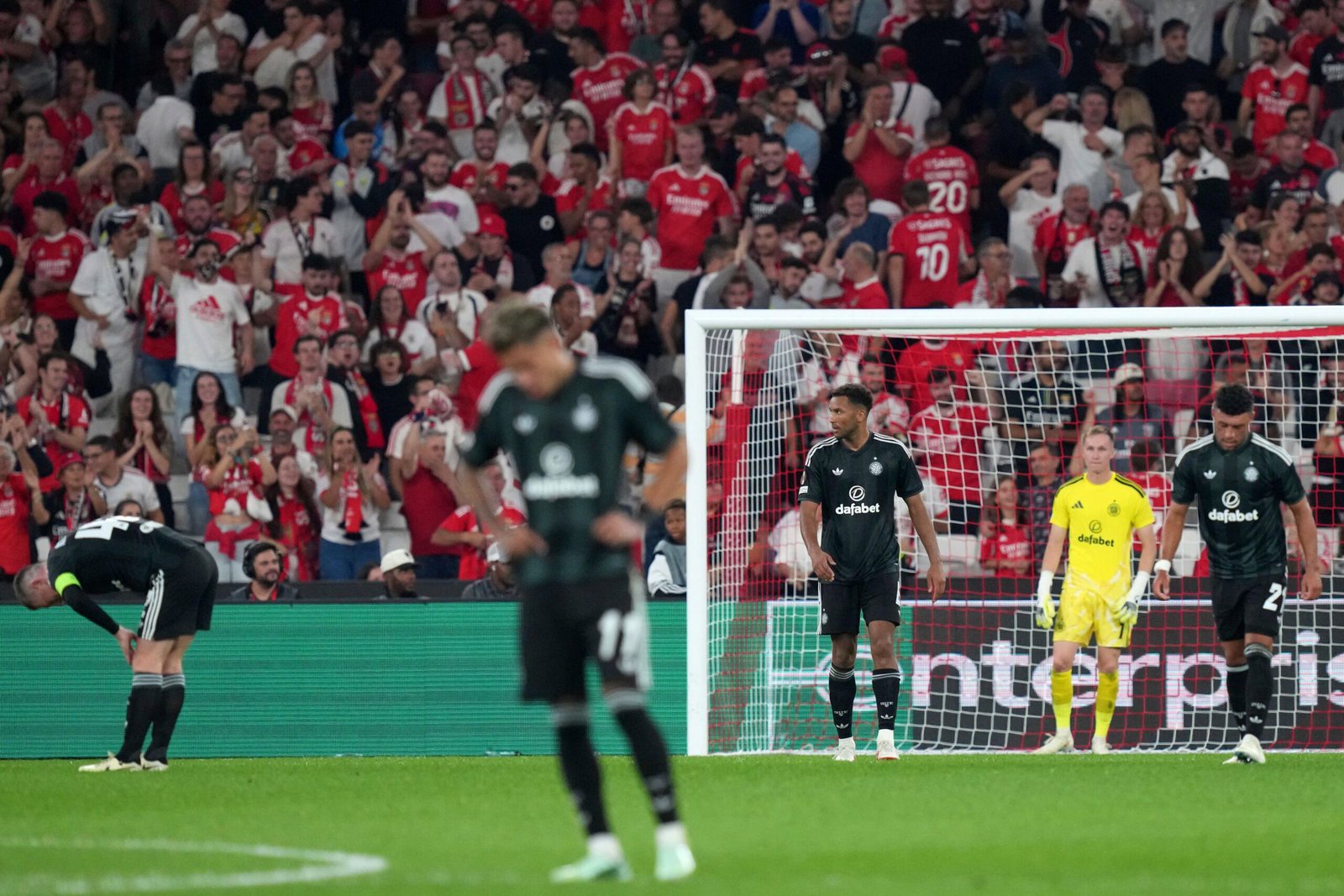 Celtic players react after Benfica score their fourth goal in the Europa League match at the Estadio da Luz