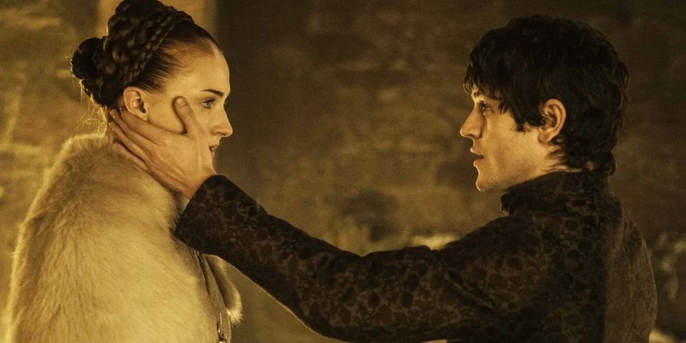 Ramsay touches Sansa’s face on their wedding night in Game of Thrones.