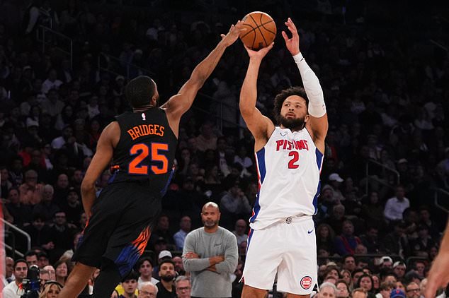 Detroit Pistons' Cade Cunningham (2) shoots over New York Knicks' Mikal Bridges (25) during the second half of an NBA basketball game Tuesday, Oct. 27, 2026, in New York. (AP Photo/Frank Franklin II)