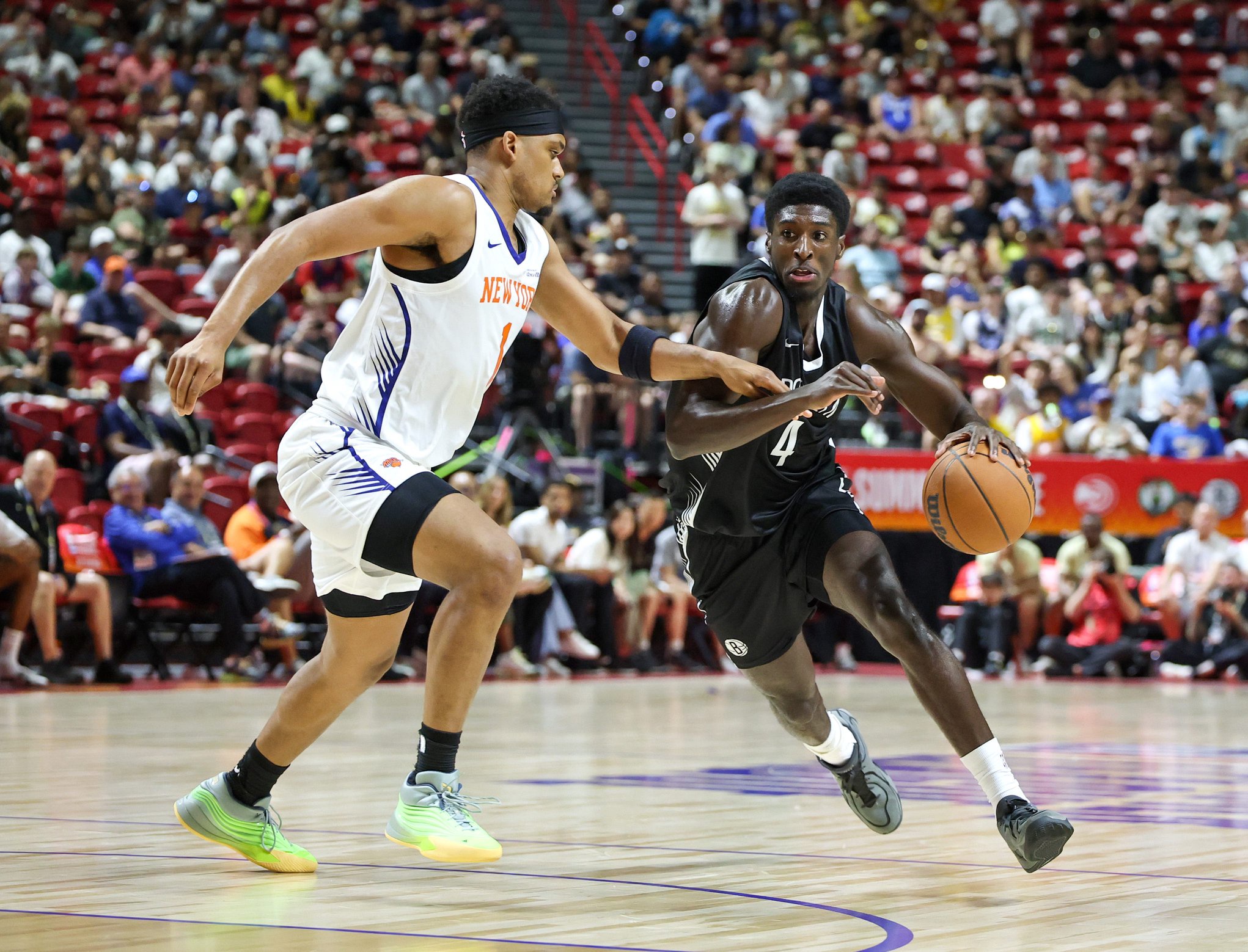 LAS VEGAS, NEVADA - JULY 10: Drake Powell #4 of the Brooklyn Nets drives against Dillon Jones #1 of the New York Knicks in the first half of a 2026 NBA Summer League game at the Thomas &amp; Mack Center on July 10, 2026 in Las Vegas, Nevada. NOTE TO USER: User expressly acknowledges and agrees that, by downloading and or using this photograph, User is consenting to the terms and conditions of the Getty Images License Agreement. (Photo by Ethan Miller/Getty Images)