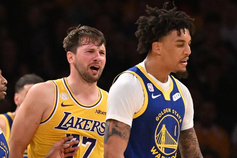 Guard Luka Doncic #77 of the Los Angeles Lakers reqacts after a foul by forward Yaxel Lendeborg #1 of the Golden State Warriors as guard Brandon Williams #12 of the Golden State Warriors tries seperate in the first half of a NBA playoff basketball game at Crypto.com Arena in Los Angeles on Wednesday, October 21, 2026