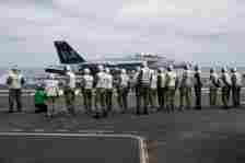 The official Ecuadorian party observes flight operations on the flight deck of Nimitz-class aircraft carrier USS George Washington (CVN 73) while underway in the Pacific Ocean, June 26, 2024.