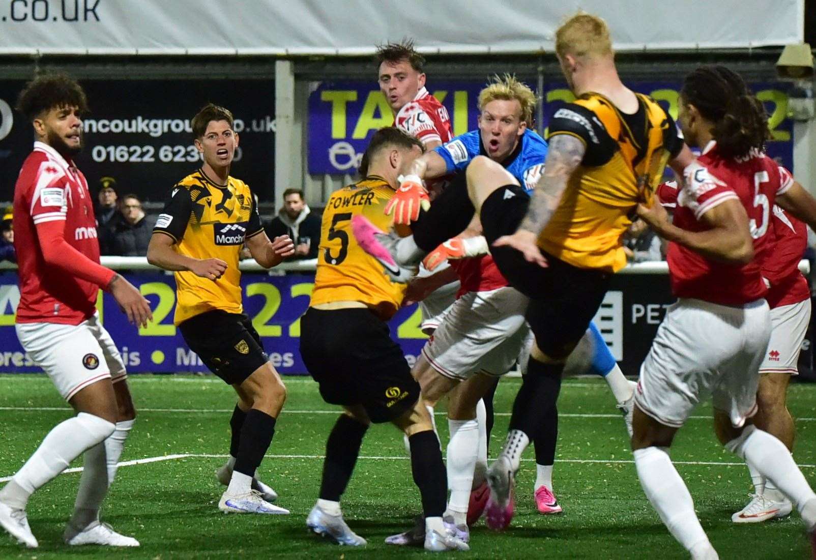 Goalmouth action from Maidstone's top-of-the-table clash with Ebbsfleet as Taylor Foran has his shirt pulled. Picture: Steve Terrell
