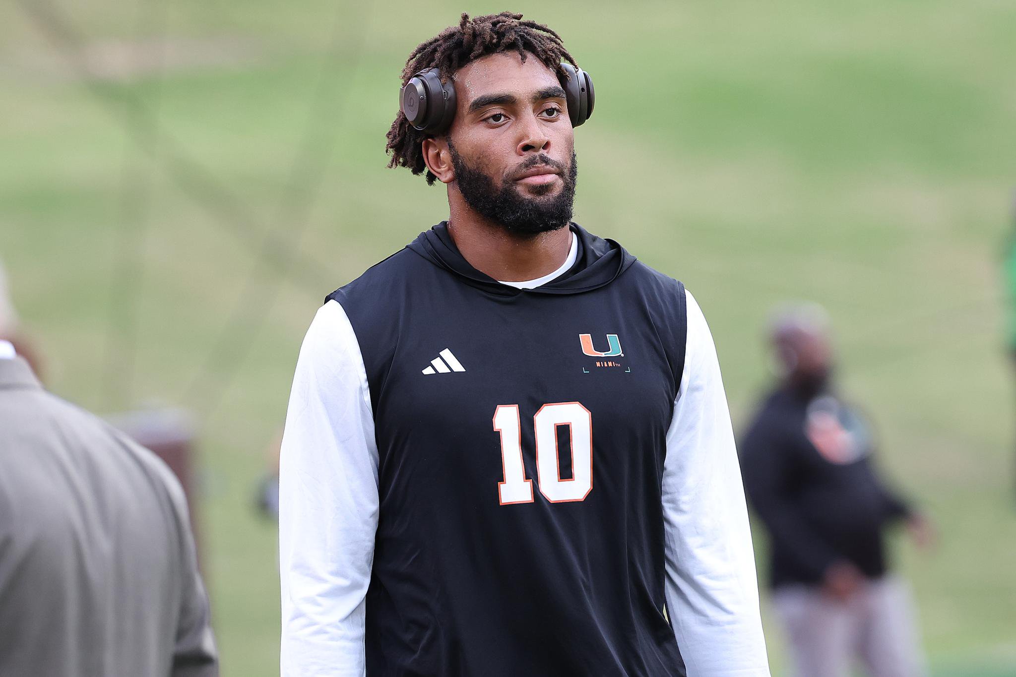 Miami Hurricanes defensive lineman Damon Wilson II wears headphones and a jersey with number 10.