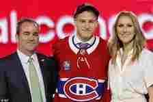 Ivan Demidov, center, poses, after being selected by the Montreal Canadiens during the first round of the NHL hockey draft