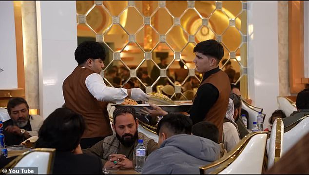 For the sit-down meal the wedding attendees were served a meat and rice dish with mantu - an Afghan dumpling filled with meat, onions and spices - washed down with a can of Pepsi