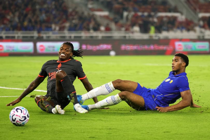 Rafael Leao of AC Milan is tackled by Josh Acheampong of Chelsea FC during the pre-season friendly between Chelsea FC and AC Milan at Gelora Bung Karno Stadium on August 08, 2026 in Jakarta, Indonesia