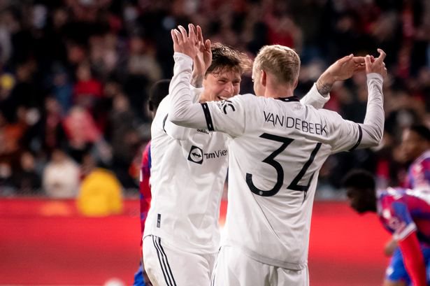 Victor Lindelof and Donny van de Beek celebrate during Manchester United's victory over Crystal Palace