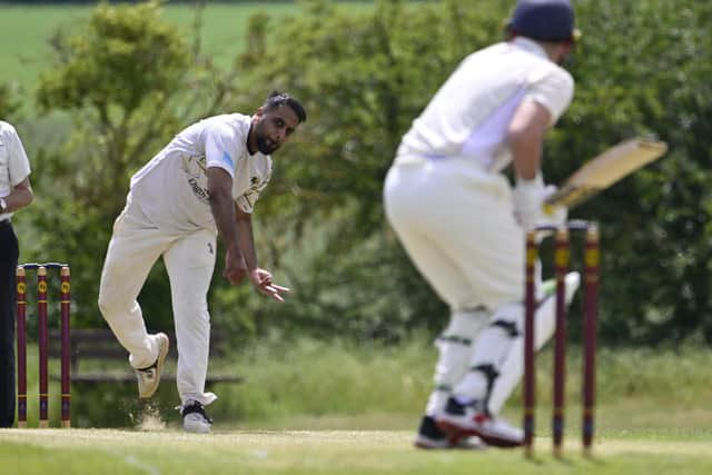 Imran Maqbool bowling for Nassington against Bretton. Photo David Lowndes.