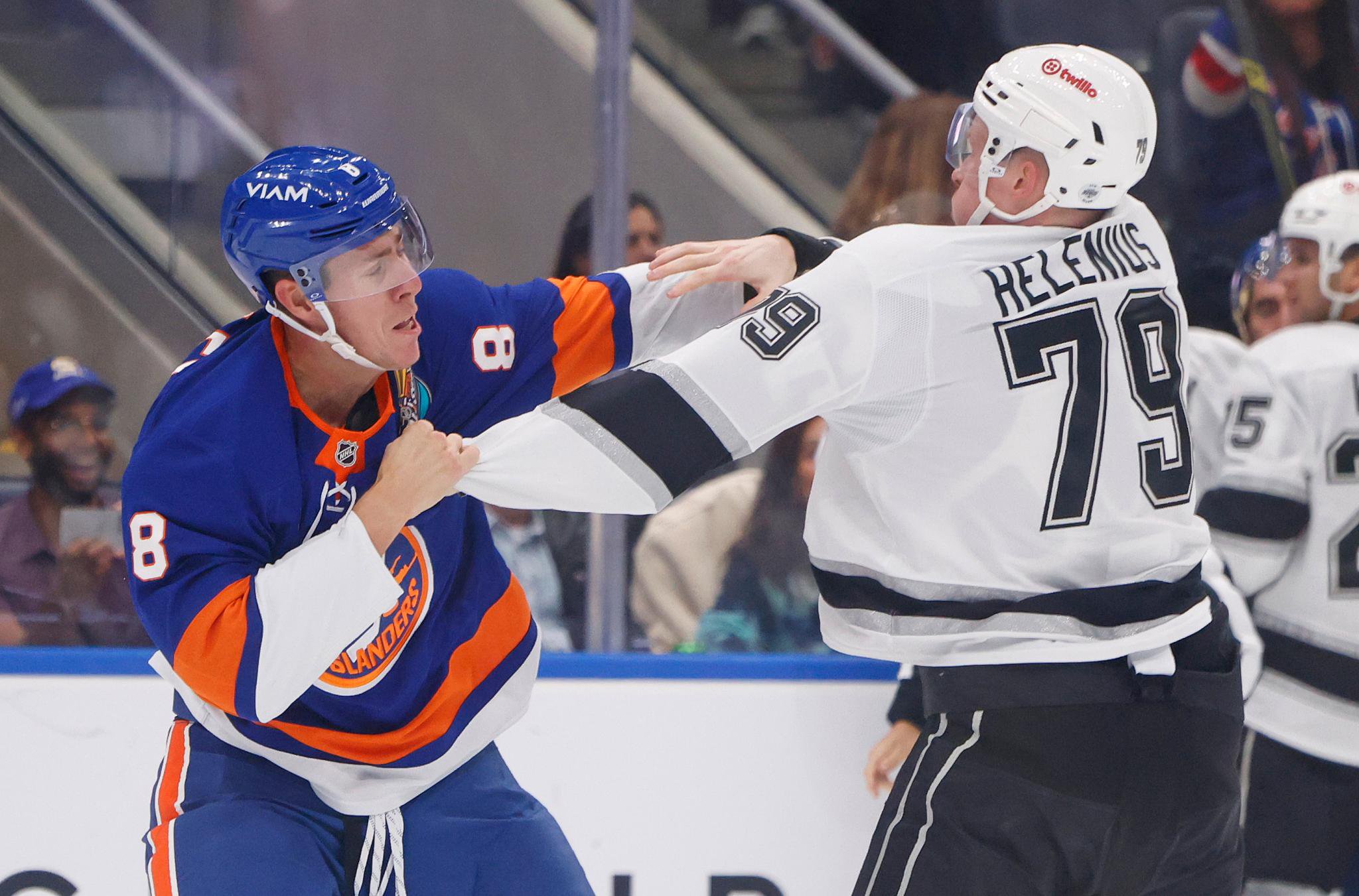 Logan Bailey (left) fights the Kings' Samuel Helenius during the Islanders' overtime loss.