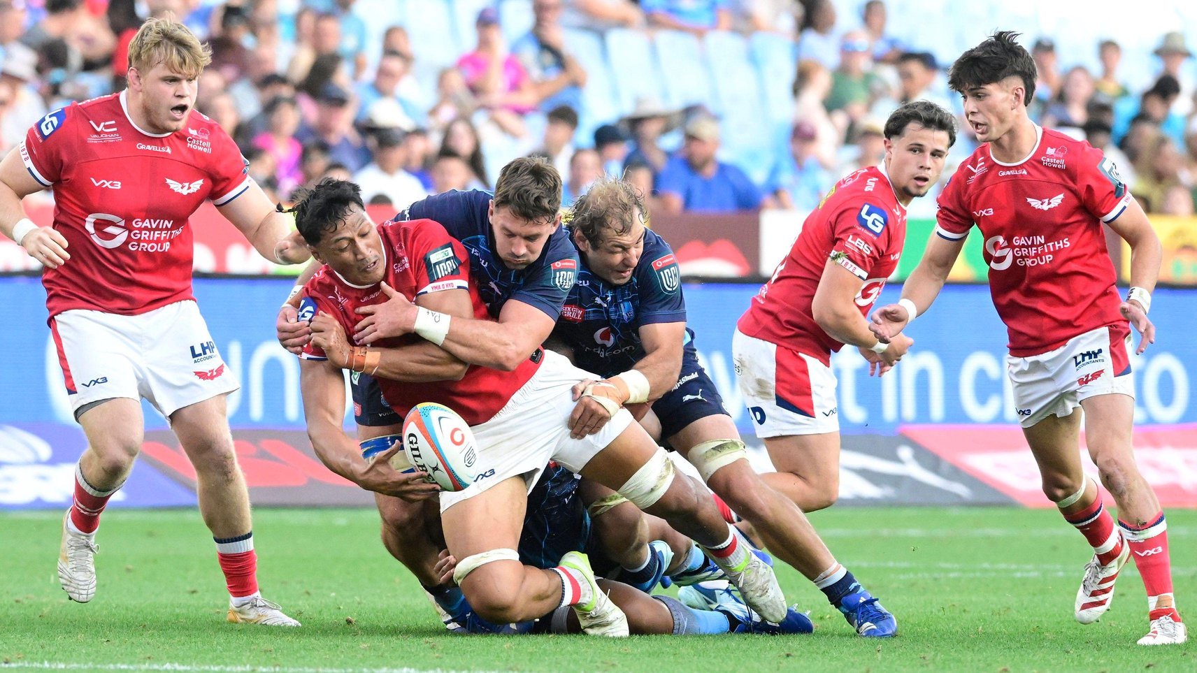 Scarlets back row Sam Lousi offloads the ball in the tackle