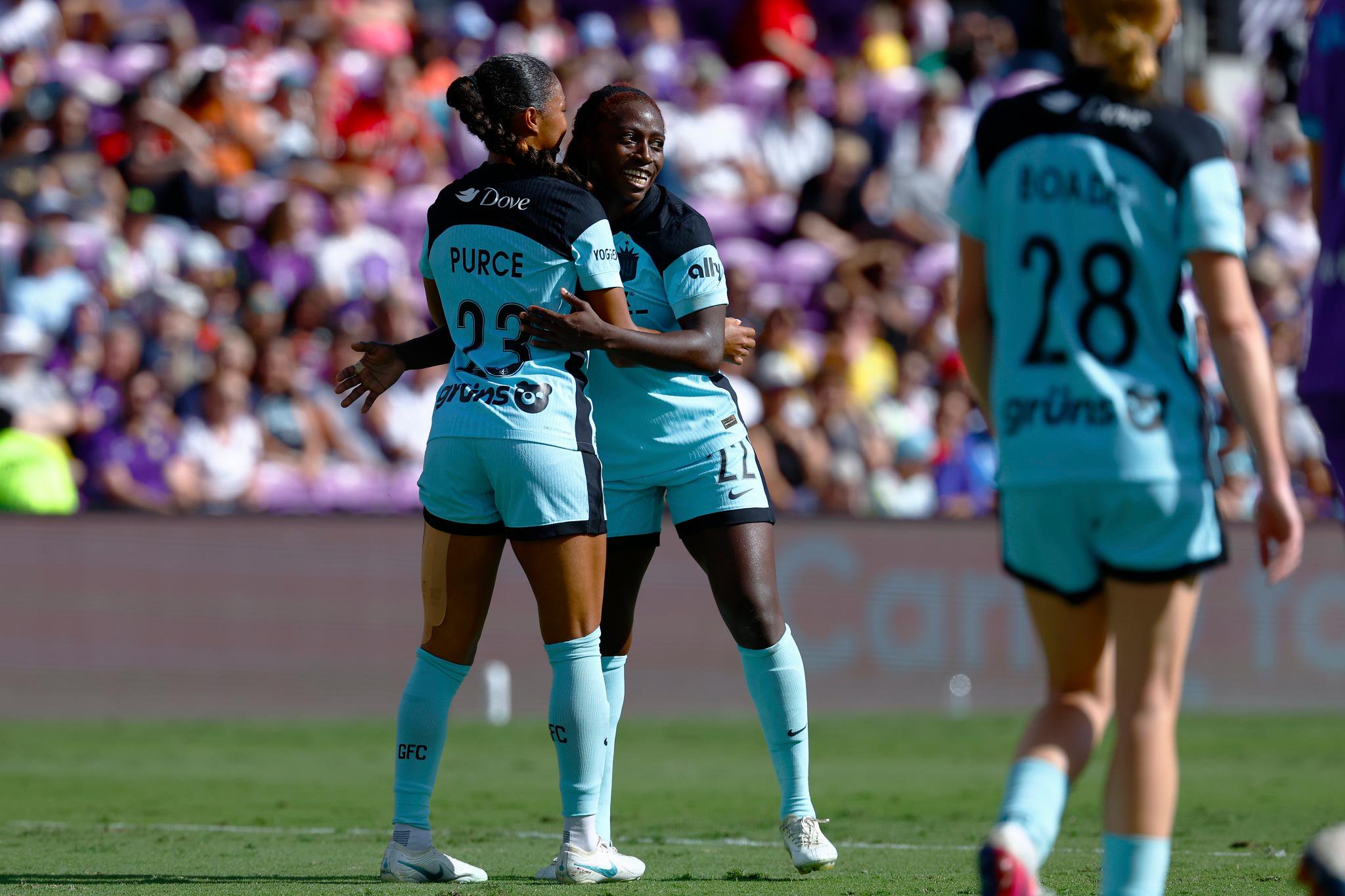 NJ/NY Gotham FC forward Midge Purce celebrates with defender Mandy Freeman following a goal against the Orlando Pride.