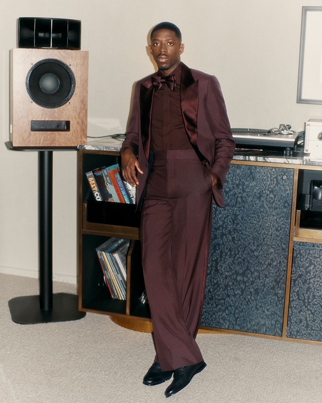 Image may contain Ousmane Dembl Person Standing Electronics Speaker Clothing Coat and Adult