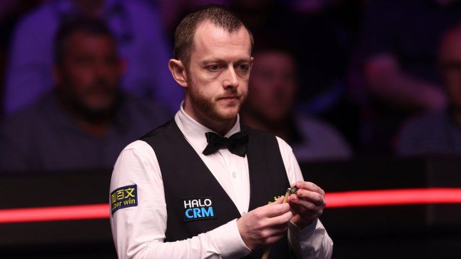 SHEFFIELD, ENGLAND - MAY 02: Mark Allen of Northern Ireland chalks the cue during the semi final match against Wu Yize of China on day fifteen of the Halo World Snooker Championship at The Crucible Theatre on May 02, 2026 in Sheffield, England. (Photo by George Wood/Getty Images)