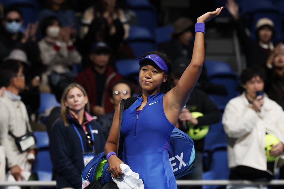 Naomi Osaka waves towards spectators after her round of 16 match against Slovakia's Mia Pohankova at the Pan Pacific Open in Tokyo, Japan. 