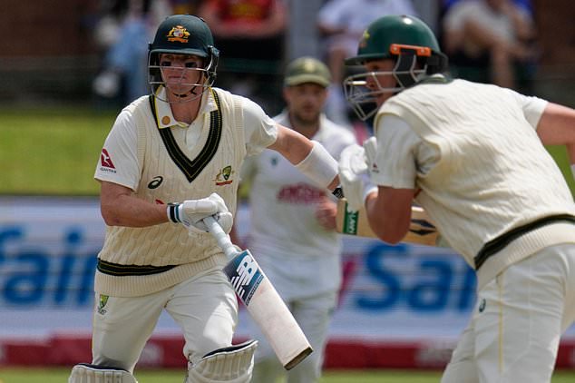 Australia's Steven Smith, left and Australia's Matt Renshaw, right run between the wickets during day four of the second cricket test match between South Africa and Australia, in Gqeberha, South Africa, Wednesday, Oct. 21, 2026. (AP Photo/Themba Hadebe)