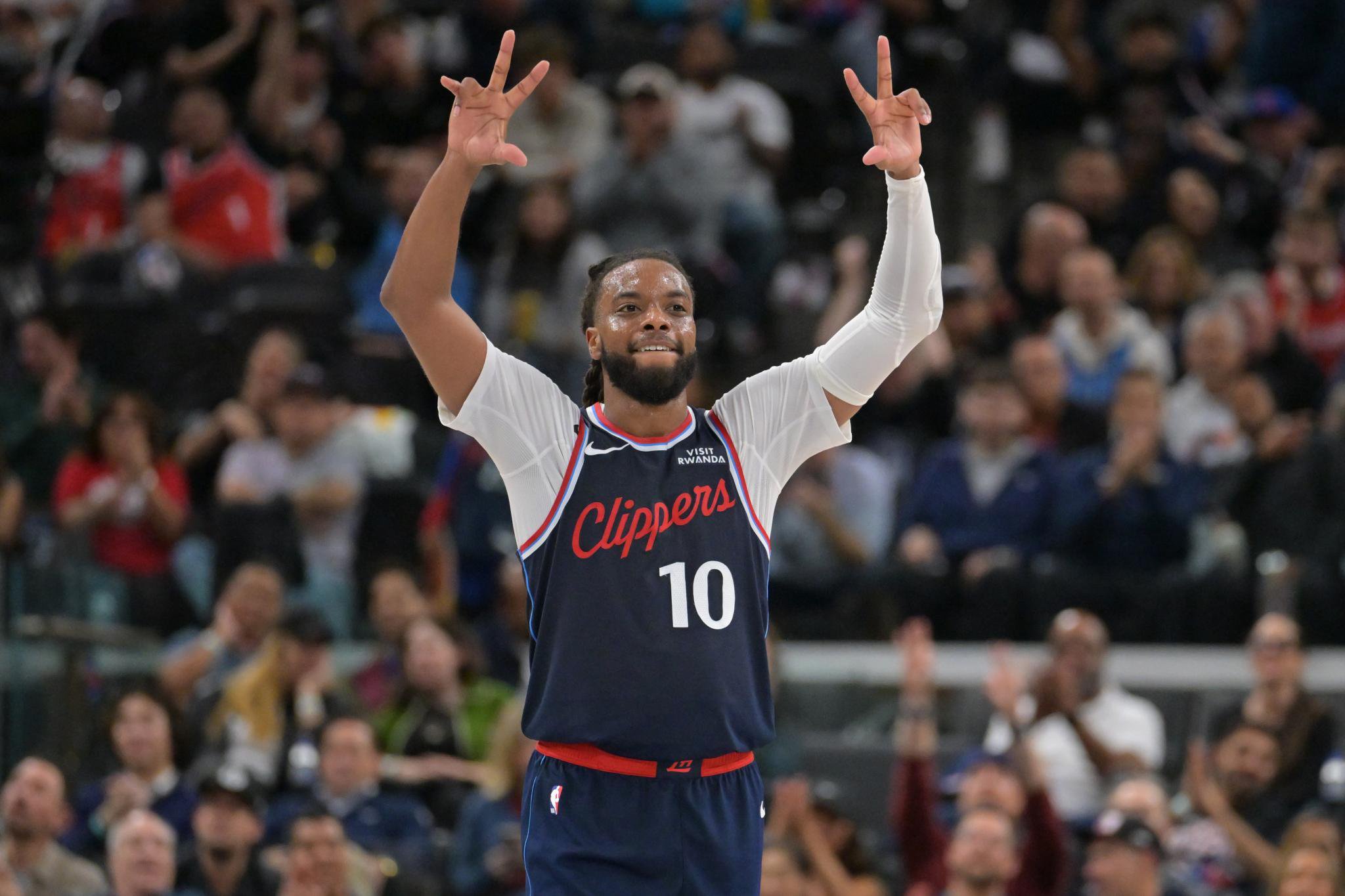 Los Angeles Clippers guard Darius Garland reacts after making a 3-point basket during a game against the Sacramento Kings.