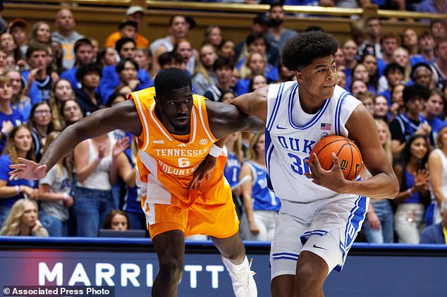 Duke's Joaquim Boumtje Boumtje (30) grabs a rebound ahead of Tennessee's DeWayne Brown II (6) during the first half of an NCAA college basketball game in Durham, N.C., Tuesday, Oct. 20, 2026. (AP Photo/Ben McKeown)