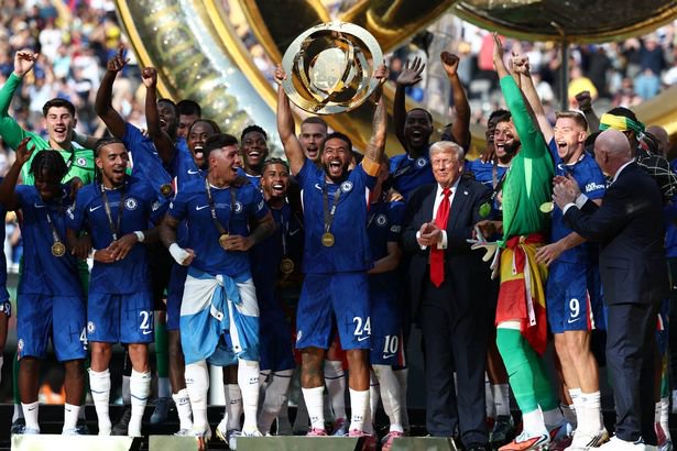 Chelsea's English defender #24 Reece James lifts the trophy with teammates next to US President Donald Trump during the award ceremony for the FIFA Club World Cup 2025 Champions