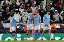Manchester City's Kevin De Bruyne (right) celebrates with team-mate Manchester City's Erling Haaland after scoring his side's equalising goal to ma...
