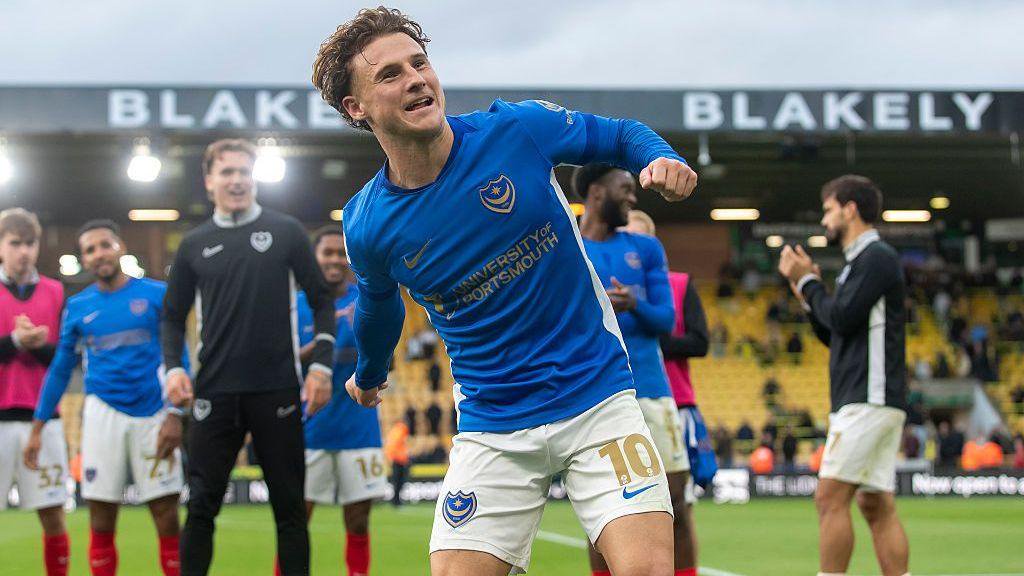 Portsmouth players celebrate their win at Norwich City