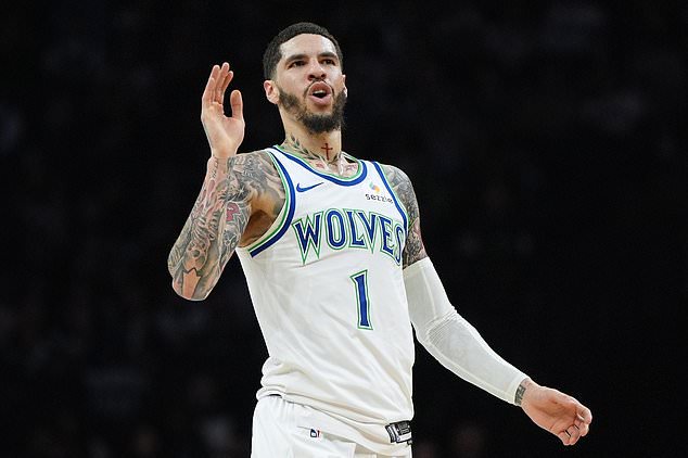 Minnesota Timberwolves guard LaMelo Ball reacts after missing a shot during the first half of an NBA basketball game against the Golden State Warriors, Wednesday, Oct. 28, 2026, in Minneapolis. (AP Photo/Abbie Parr)