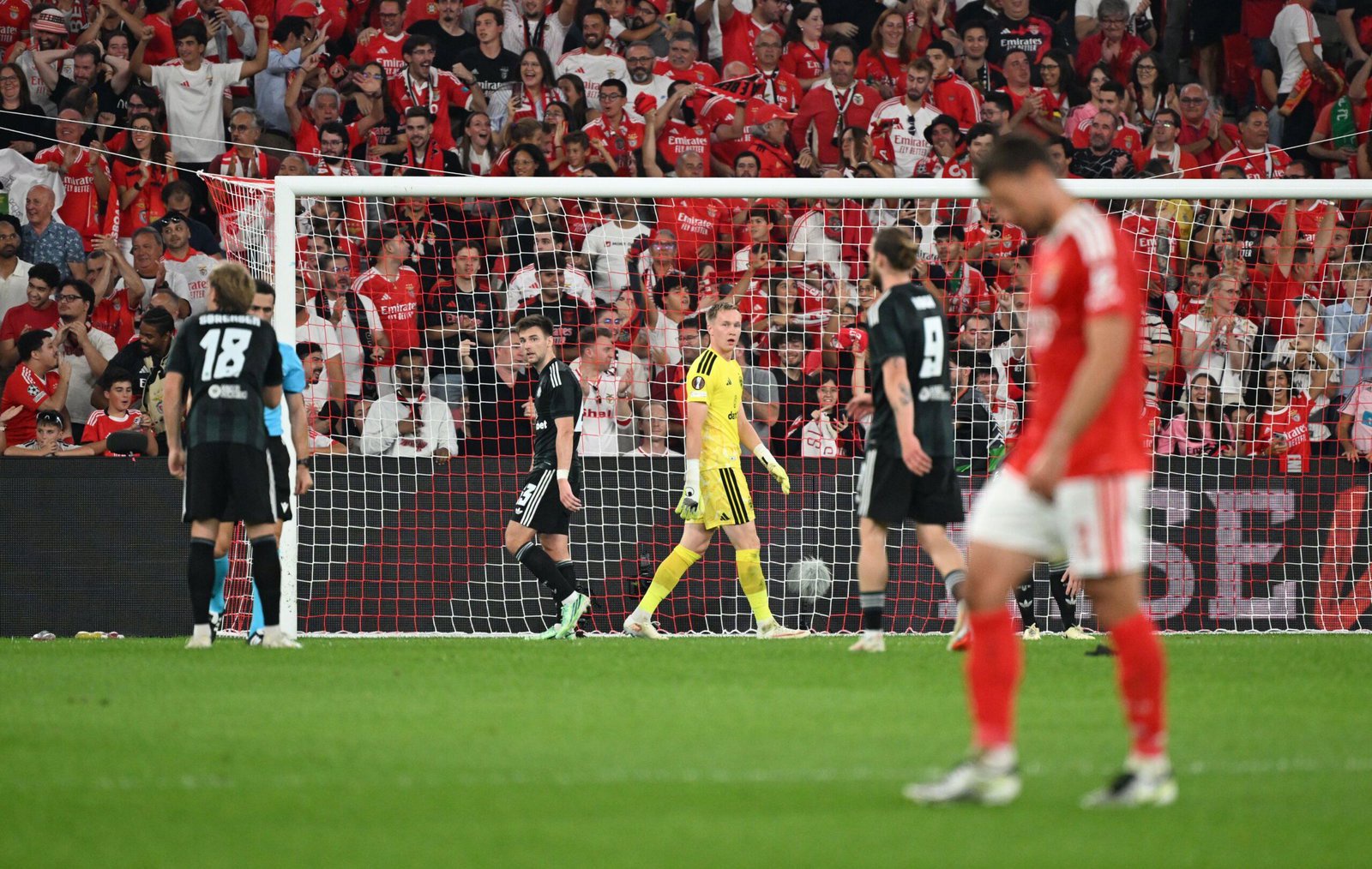 Celtic players dejected after conceding a third goal against Benfica in the Europa League at the Estadio da Luz, Lisbon