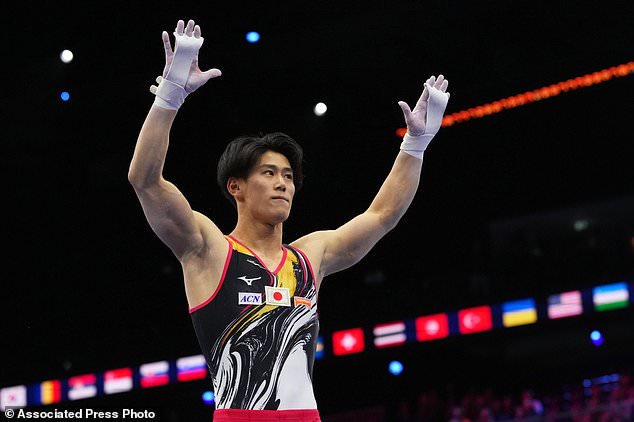 Daiki Hashimoto, of Japan, gestures after competing in the horizontal bar during the men's all-around final at the Artistic Gymnastics World Championships in Rotterdam, the Netherlands, Thursday, Oct. 22, 2026. (AP Photo/Francisco Seco)