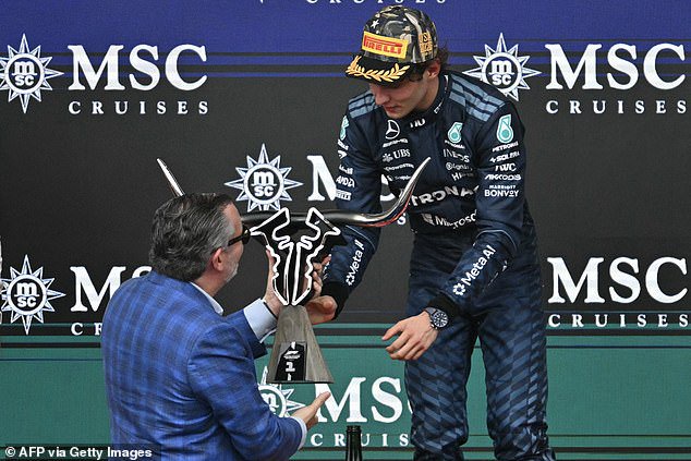 Cruz got the icy reception as he passed off the winner's trophy to Mercedes' Kimi Antonelli