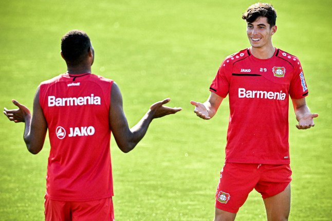 epa08563114 Leverkusen's Kai Havertz (R) and his teammate Jonathan Tah (L) attend their team's first training session at the training ground in Leverkusen, Germany, 23 July 2020. The German Bundesliga will start on 18 September 2020 into the next season 2020/21. The German Football League (DFL) will announce the Bundesliga match schedules on 07 August 2020. EPA/SASCHA STEINBACH