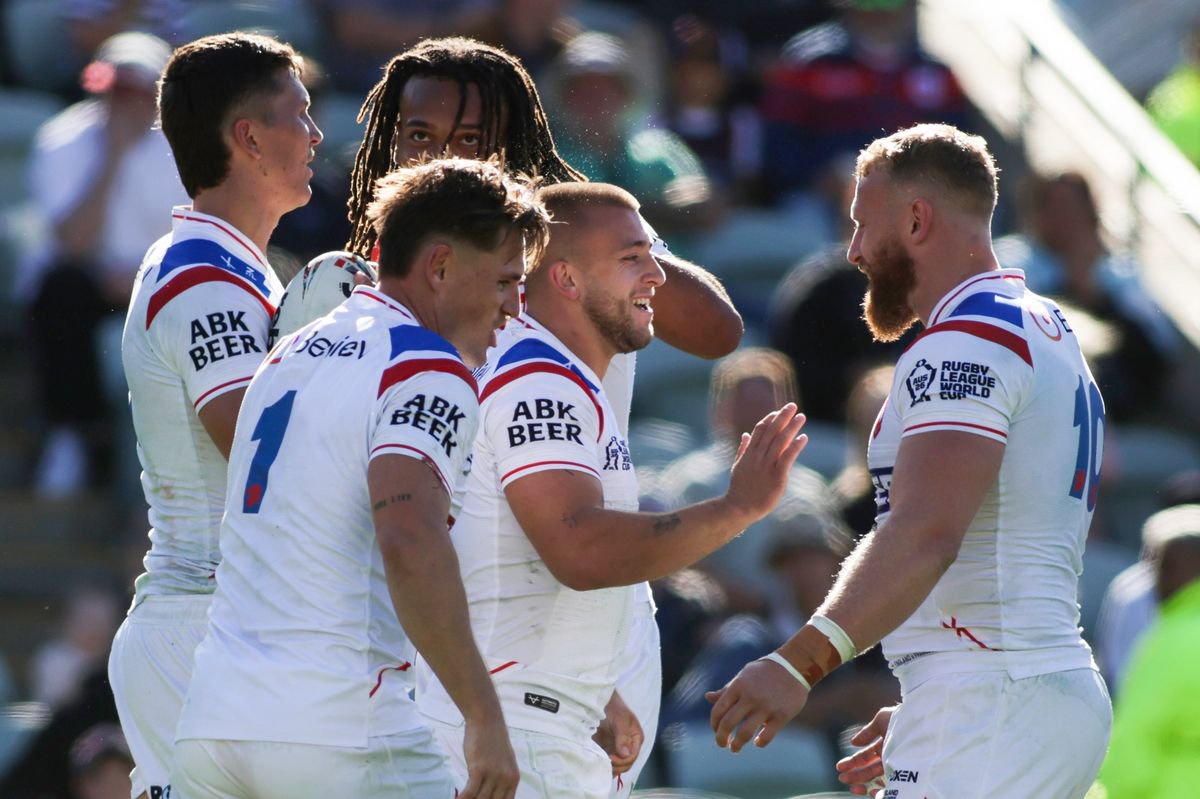 England's Mikey Lewis is congratulated on scoring a try against France.