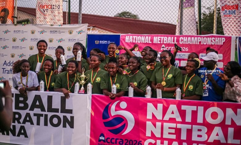 Players and officials of Hunters Hand celebrating with the trophy