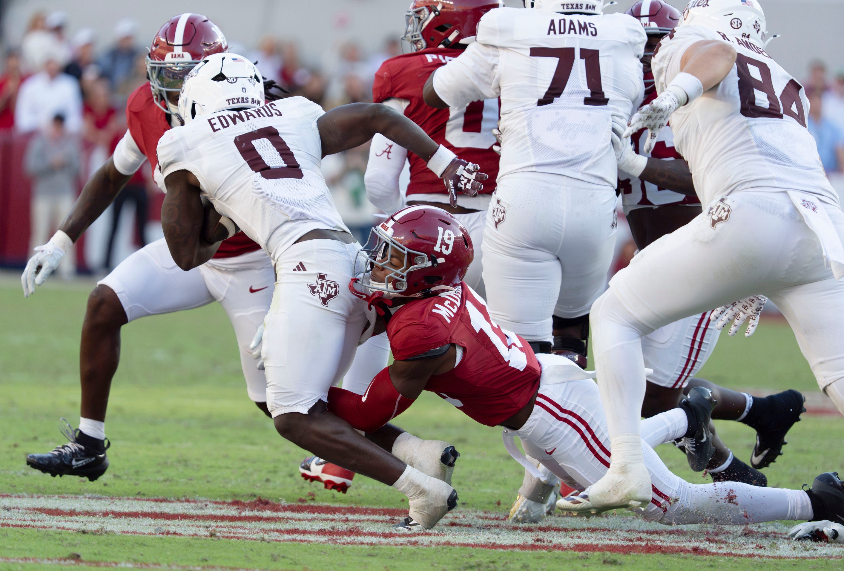 Oct 24, 2026; Tuscaloosa, AL, USA;  Alabama defensive back Chuck McDonald III (19) makes a tackle on Texas A&amp;M running back KJ Edwards (0) at Saban Field at Bryant Denny Stadium. Alabama defeated Texas A&amp;M 31-20. Mandatory Credit: Gary Cosby Jr.-Tuscaloosa News