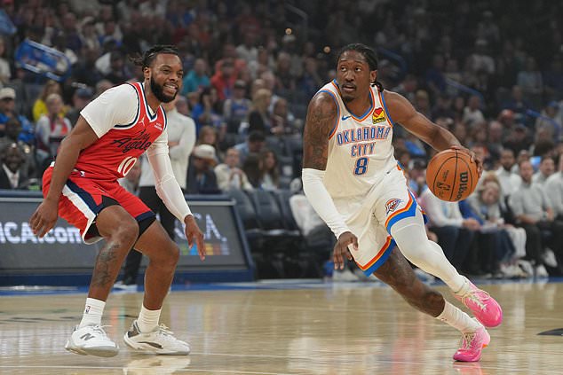 Oklahoma City Thunder guard Jalen Williams (8) drives past Los Angeles Clippers guard Darius Garland (10) during the first half of an NBA basketball game, Sunday, Oct. 25, 2026, in Oklahoma City. (AP Photo/Kyle Phillips)