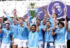 Manchester City's Ilkay Gundogan lifts the Premier League trophy