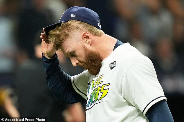 Tampa Bay Rays pitcher Cam Booser leaves the game during the fifth inning of Game 3 of baseball's World Series, Monday, Oct. 26, 2026, in St. Petersburg, Fla., between the Milwaukee Brewers and the Tampa Bay Rays. (AP Photo/Ashley Landis)