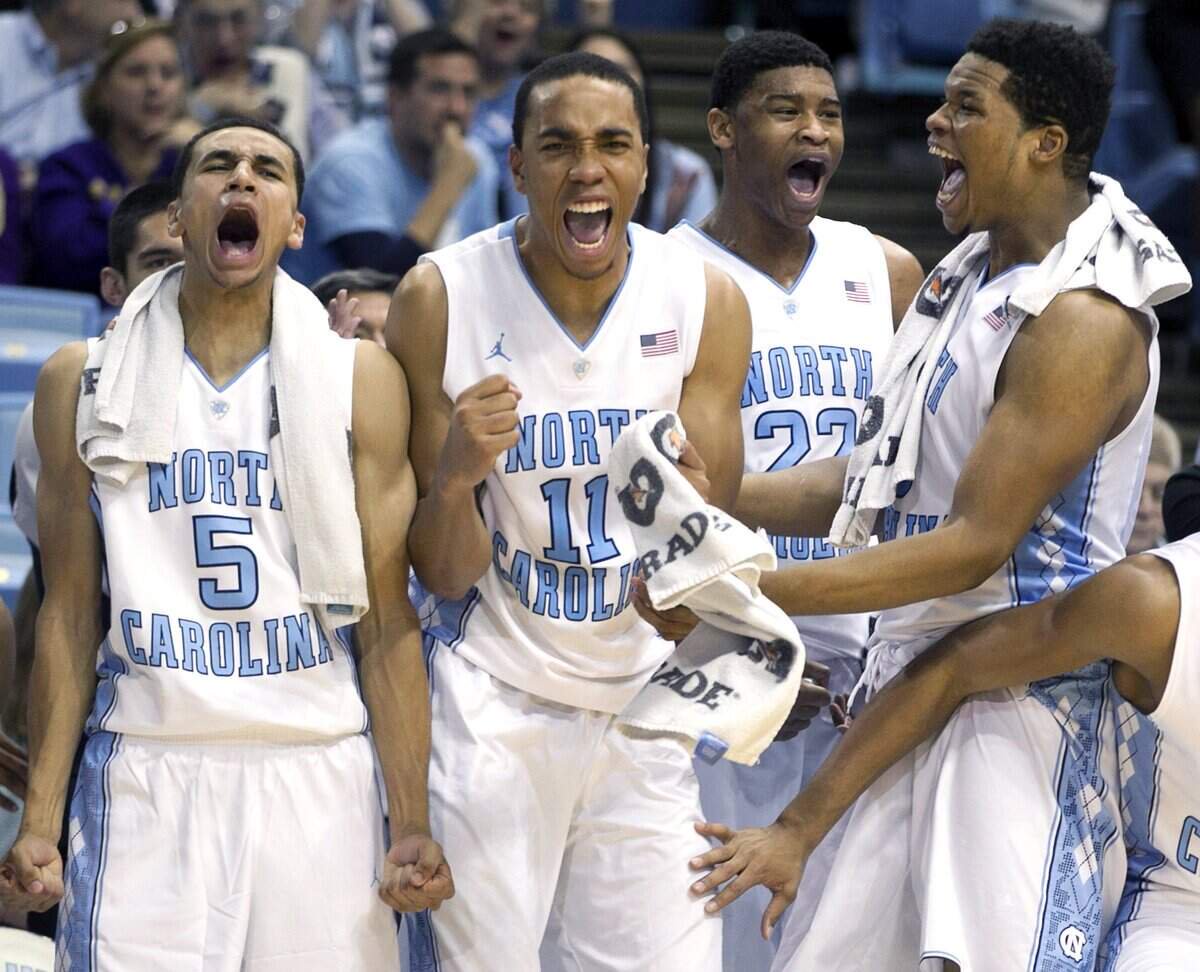 UNC's Marcus Paige (5, far left), Brice Johnson (11), Kennedy Meeks (3) and Isaiah Hicks (22) celebrate after a basket in 2014.