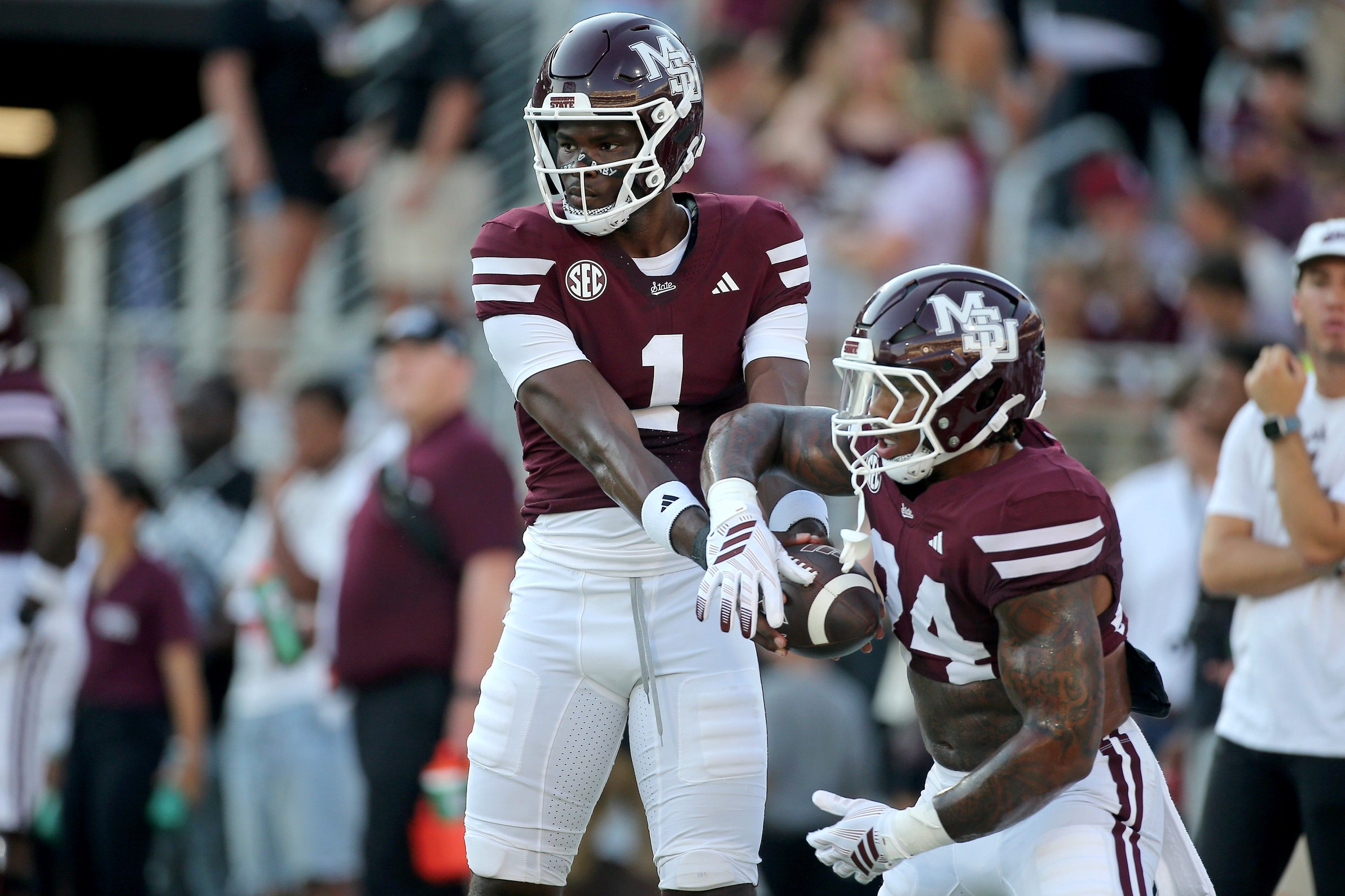 Sep 5, 2026; Starkville, Mississippi, USA;  Mississippi State Bulldogs quarterback Kamario Taylor (1) hands the ball off to running back Fluff Bothwell (24) during warm ups  prior to the game  against the Louisiana Monroe Warhawks  at Davis Wade Stadium at Scott Field.  Mandatory Credit: Petre Thomas-Imagn Images