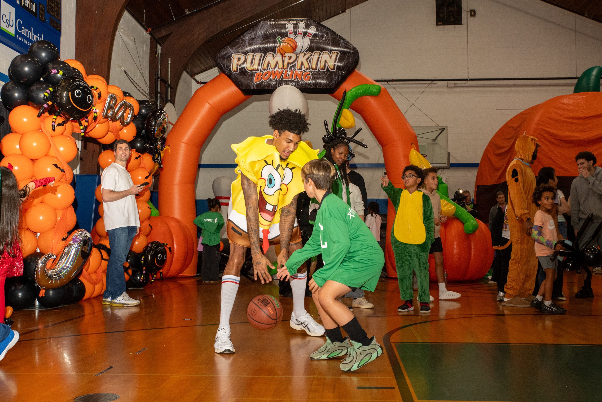 Dillon Mitchell engaging with local youth at the Boston Celtics Halloween event.
