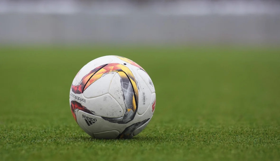 Archive photograph of a football on grass in 2017; not an image of Young Africans or the coaches.